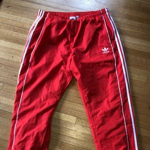 Adidas Red trackpants sold by Urban Outfitters